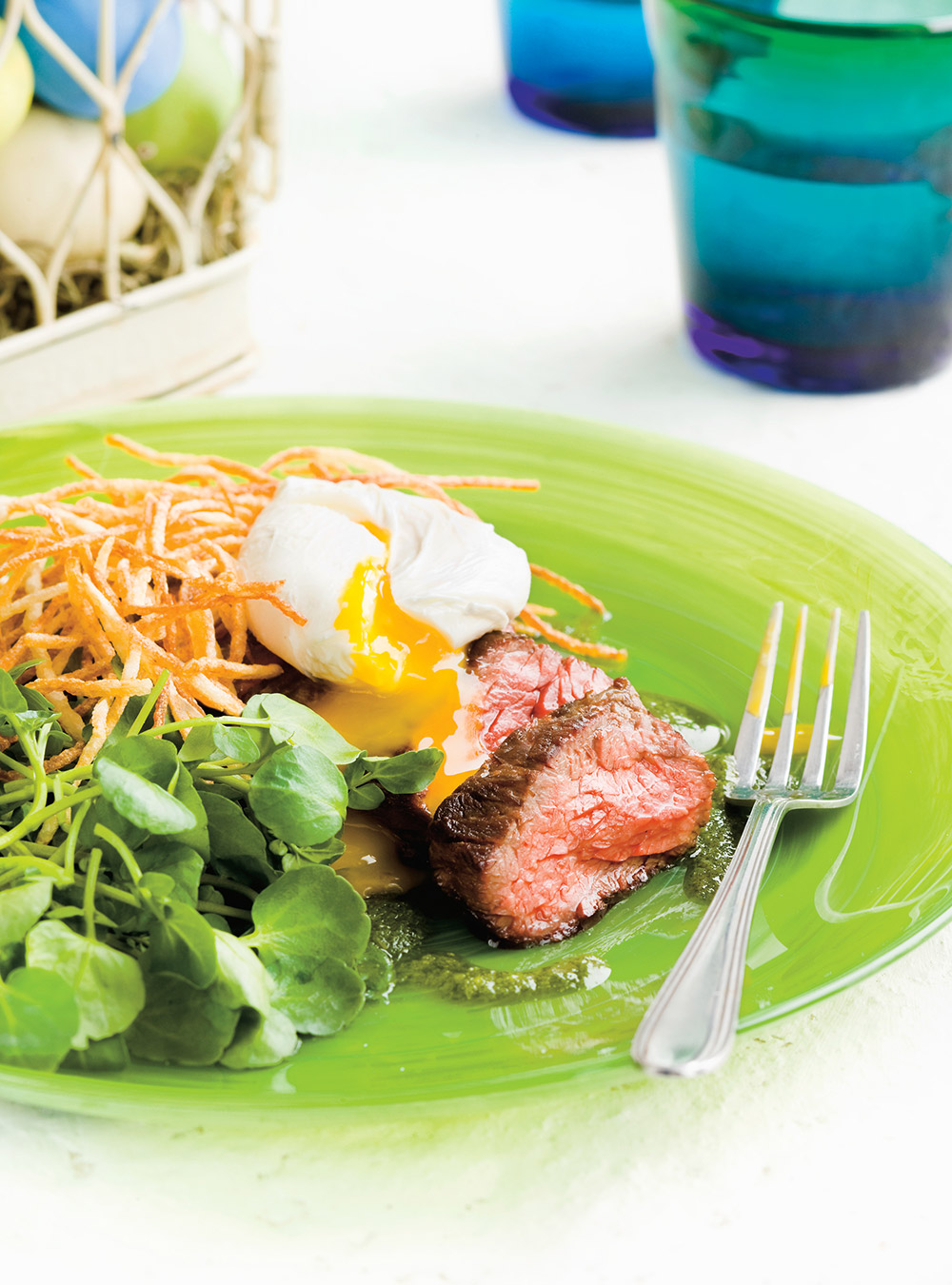 Grilled Skirt Steaks with Eggs, Watercress Dressing and Shoestring Fries   