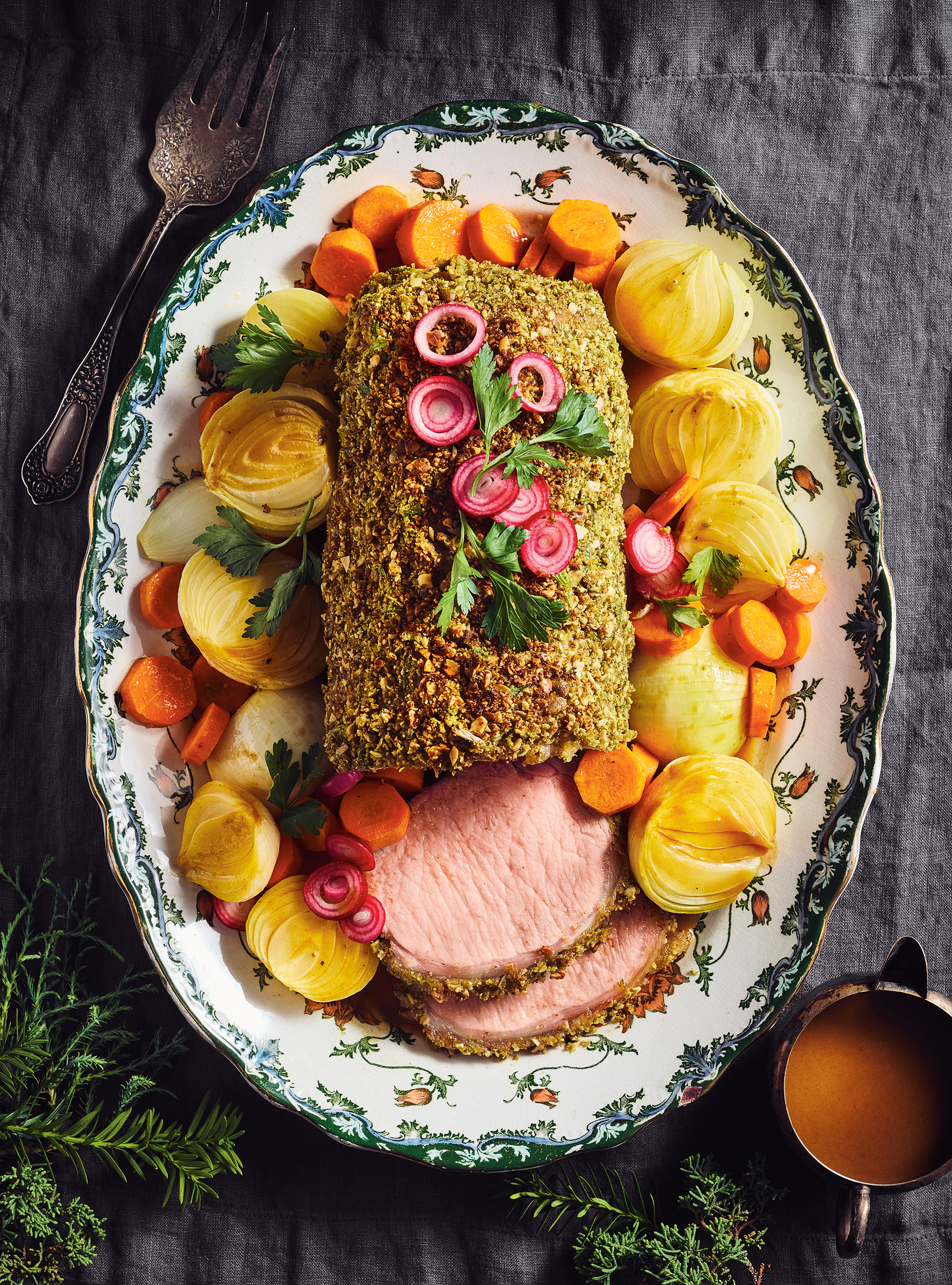 Pork Loin Roast with Pumpkin Seed Crust and Onions in Carrot Juice